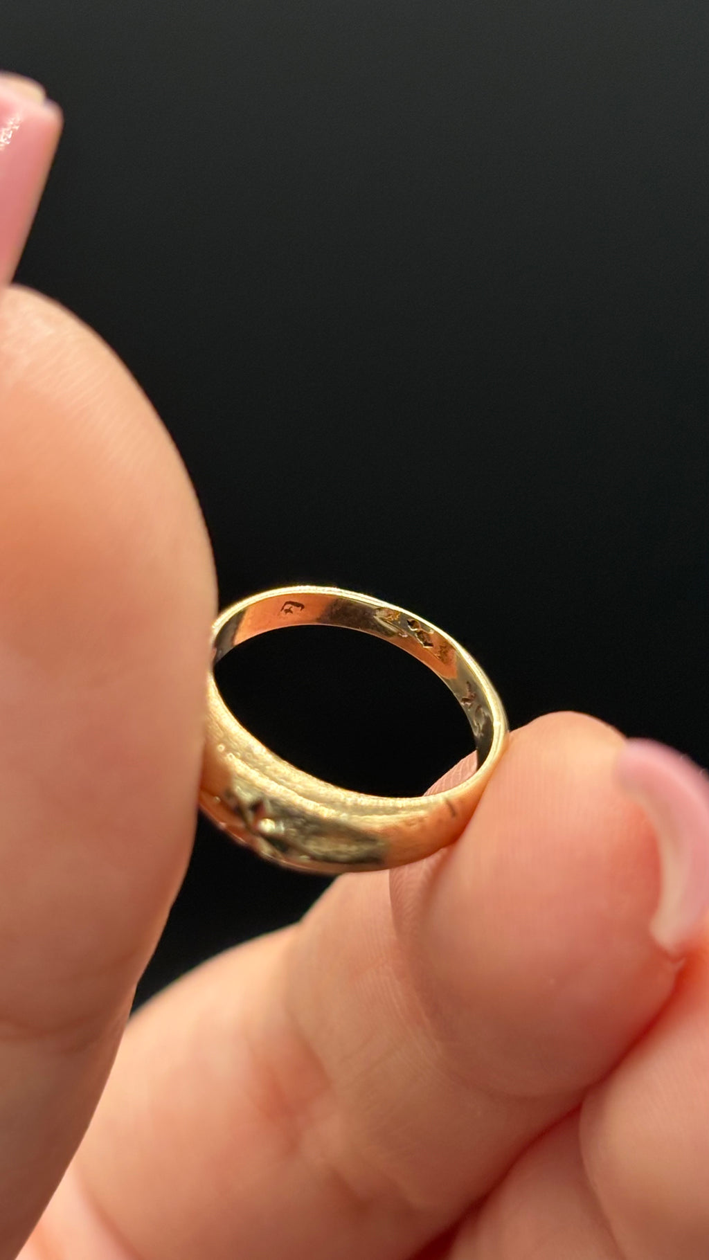 inside the back of 10k solid gold star engraved dome pinky ring band showing condition