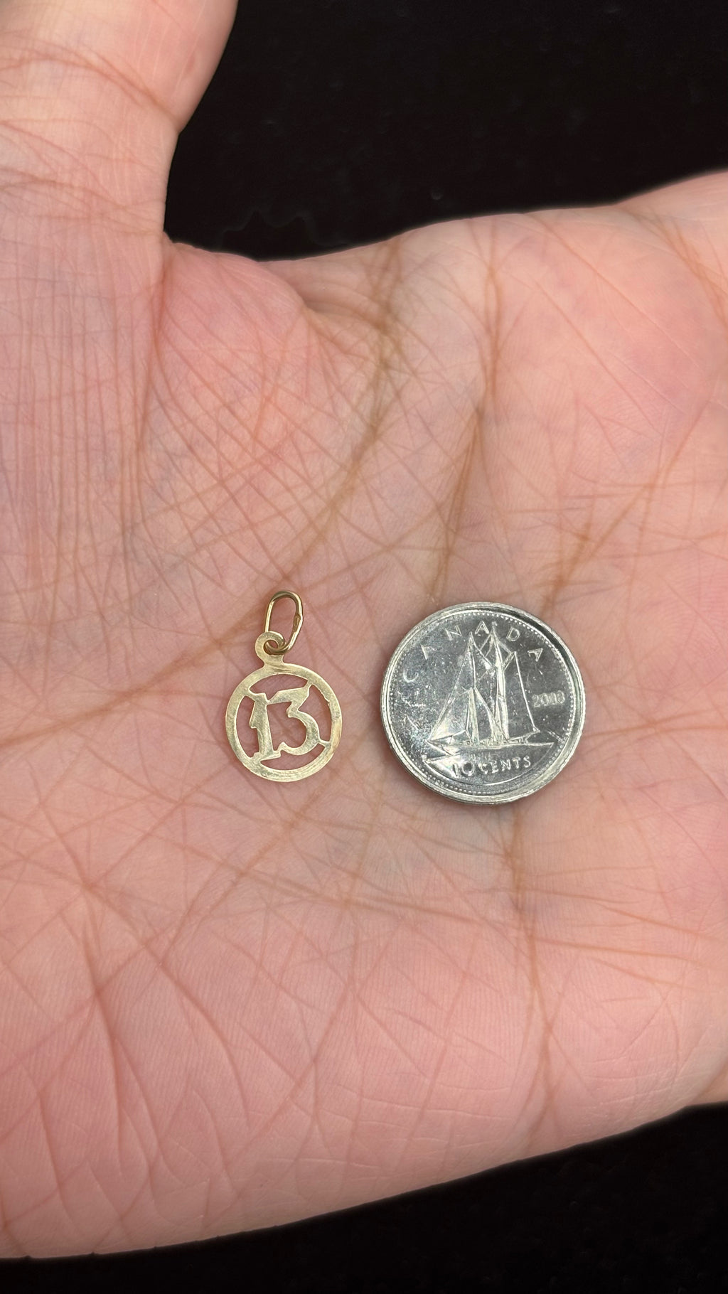10k solid gold mini 13 charm next to 10 cent coin for size reference