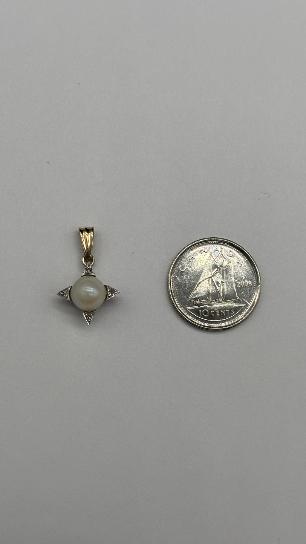 10k solid gold pearl and diamonds star charm moving side to side