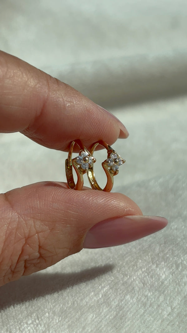 14k Solid Gold Clear Stone Flower Huggie Hoops close-up showing detail and condition