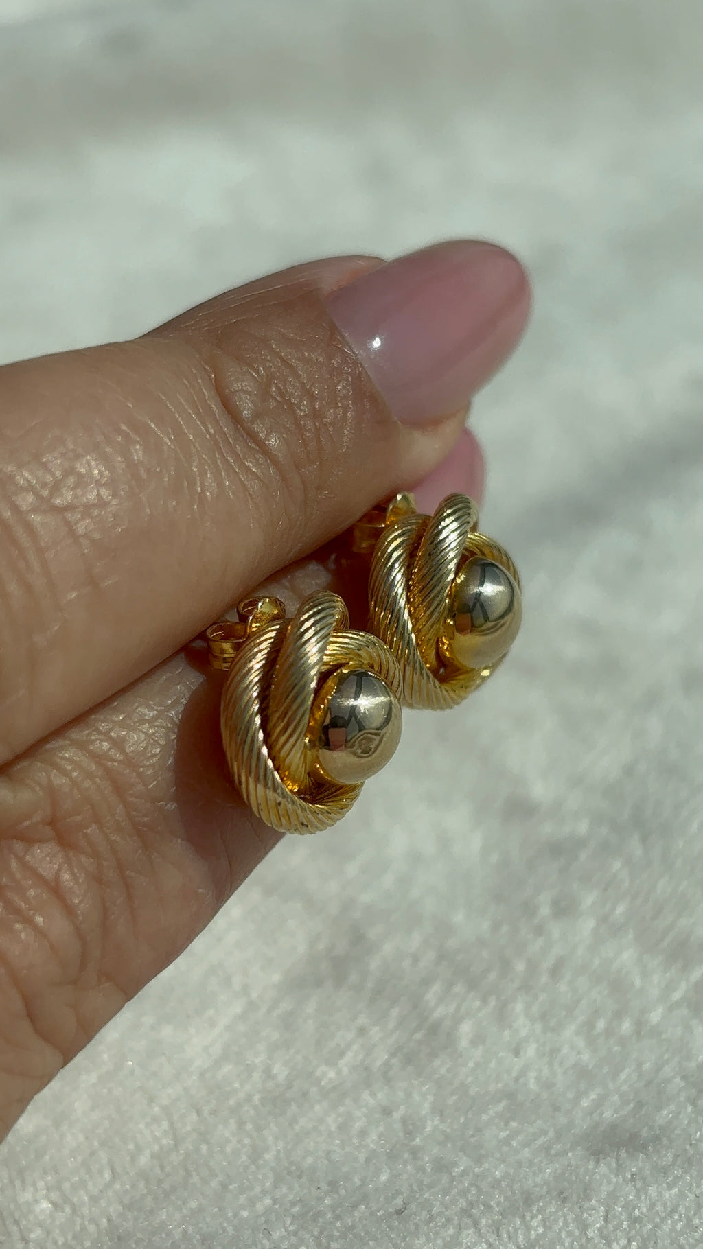 10k Solid Gold Knot Ball Earrings angled close-up showing shine and dimension