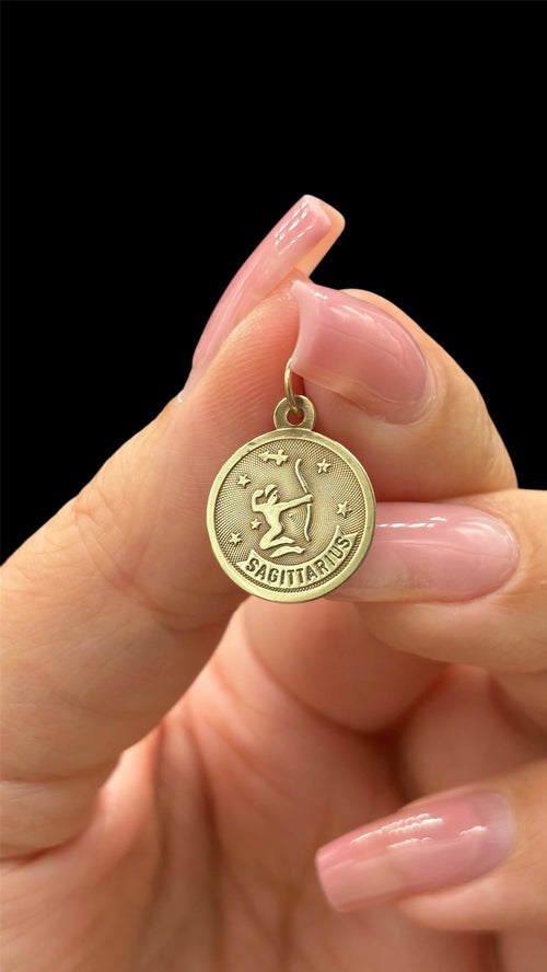 Front of 10k solid gold Sagittarius charm