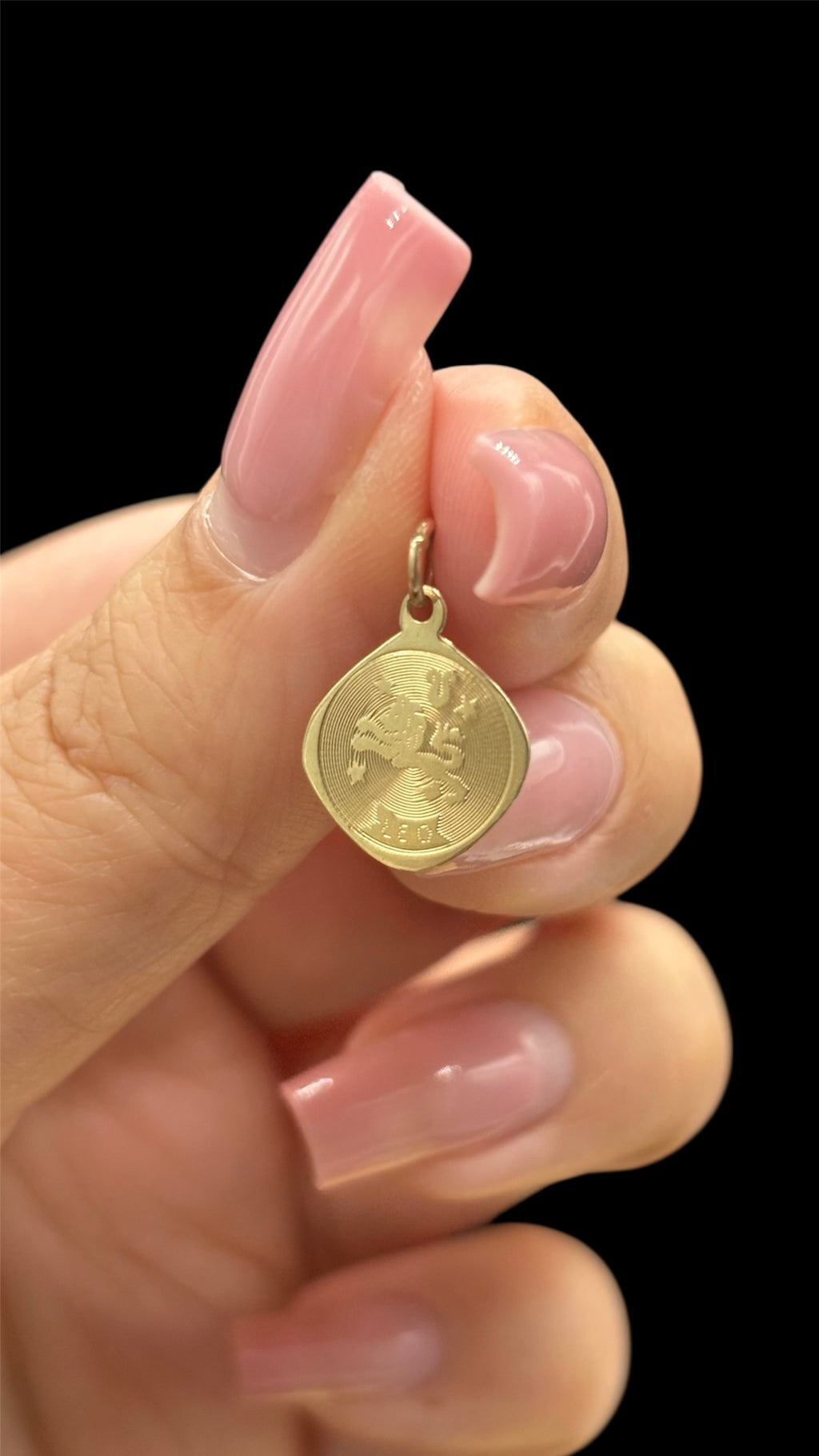 Front of 10k solid gold Leo charm