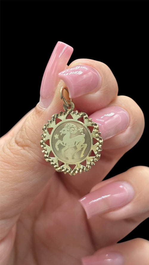 Front of 10k solid gold Aries charm with diamond cut scalloped edge
