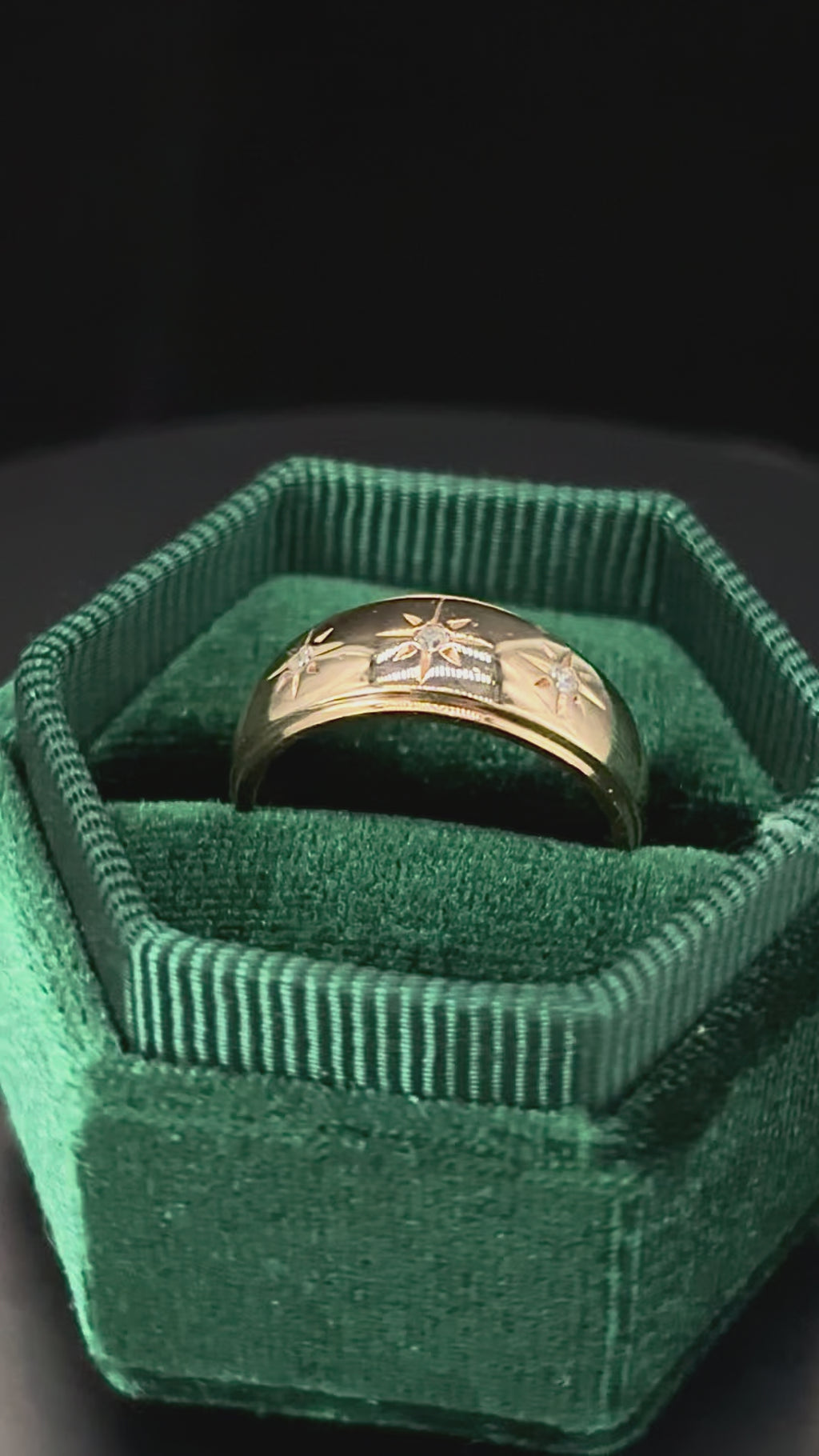 Rotating 10k solid gold star-set diamond trilogy tapered band in green box