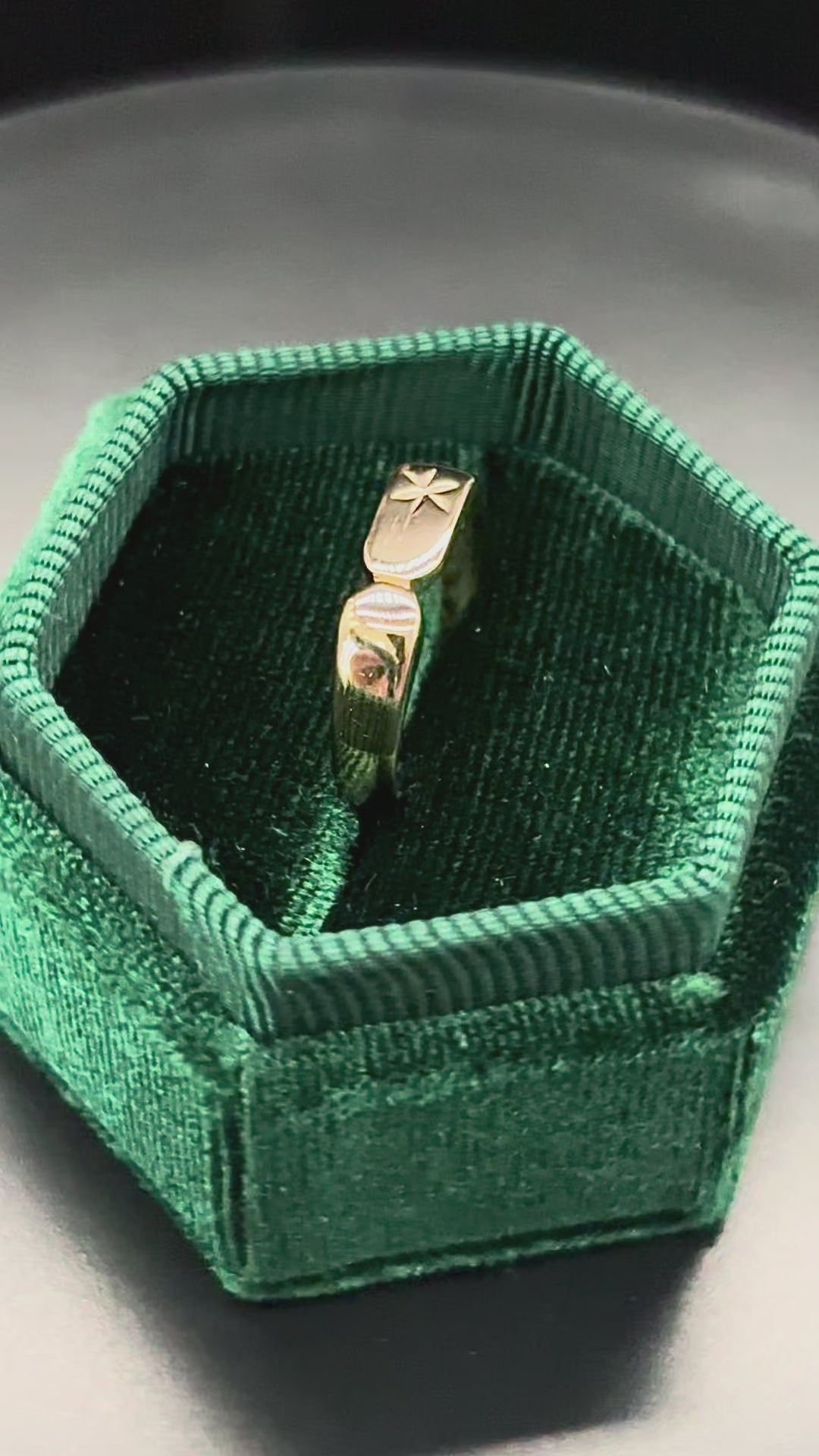 Rotating 10k solid gold slim rectangle signet ring in green box
