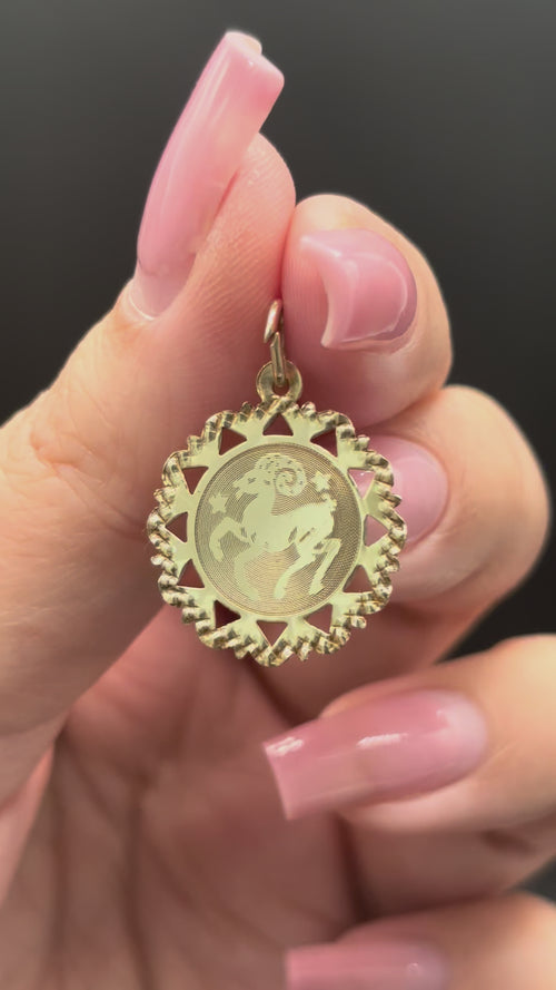 10k solid gold Aries charm with diamond cut scalloped edge moving side to side